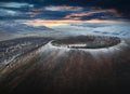 Aerial view of the barren Uran Togoo dead volcano at sunset