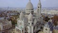 Aerial view of The Basilica of the Sacred Heart of Paris and Montmartre from right to left