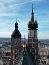 Aerial view of the Basilica of Saint Mary in Krakow on the background of bright blue sky