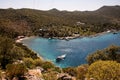 aerial view of the bay with turquoise sea water and yachts cruising along it