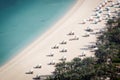 Aerial view of beach with beds, umbrellas and turquoise sea Royalty Free Stock Photo
