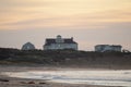 Aerial view of beach with buildings in Little Compton during sunset