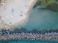 Aerial view of a beach with canoes, boats and umbrellas. Pier of Pizzo Calabro, Calabria, Italy Royalty Free Stock Photo