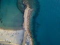 Aerial view of a beach with canoes, boats and umbrellas. Pier of Pizzo Calabro, Calabria, Italy Royalty Free Stock Photo