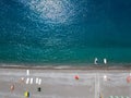 Aerial view of a beach with canoes, boats and umbrellas. Praia a Mare, Province of Cosenza, Calabria, Italy