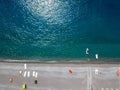 Aerial view of a beach with canoes, boats and umbrellas. Praia a Mare, Province of Cosenza, Calabria, Italy