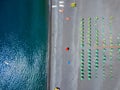 Aerial view of a beach with canoes, boats and umbrellas. Praia a Mare, Province of Cosenza, Calabria, Italy