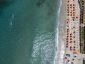 Aerial view of a beach with canoes, boats and umbrellas Royalty Free Stock Photo