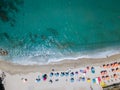 Aerial view of a beach with canoes, boats and umbrellas Royalty Free Stock Photo