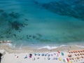 Aerial view of a beach with canoes, boats and umbrellas Royalty Free Stock Photo