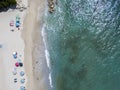 Aerial view of a beach with canoes, boats and umbrellas Royalty Free Stock Photo