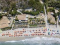 Aerial view of a beach with canoes, boats and umbrellas Royalty Free Stock Photo