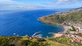 Aerial view of the beach with green mountains and buildings. Machico, Madeira. Royalty Free Stock Photo