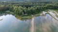 Aerial view of the trees in the woods and the beach and the blue water, beautiful clear sea water on a warm sunny day Royalty Free Stock Photo