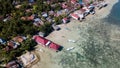 Aerial view from the beachside village near the jetty with many boat docking