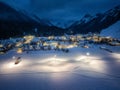 Aerial view of beautiful alpine village at cold winter night Royalty Free Stock Photo