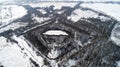 Aerial view of beautiful ancient fortress in forest in winter. Tarakaniv Fort. Royalty Free Stock Photo