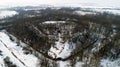 Aerial view of beautiful ancient fortress in forest in winter. Tarakaniv Fort. Royalty Free Stock Photo