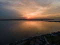 Aerial view of a beautiful bay in the evening, with the sun setting over the horizon Royalty Free Stock Photo