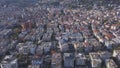 Aerial view of a beautiful city under the light of the summer sun. Art. Flying over the modern city with houses and Royalty Free Stock Photo