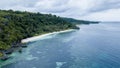 Aerial view of beautiful and clean beach beside blue ocean with nice sky Royalty Free Stock Photo