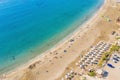 Aerial view of beautiful Coral beach in Paphos with azure seawater, Cyprus. Sand coast with umbrellas, sunbeds, people Royalty Free Stock Photo