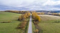 Aerial view a beautiful countryside road outside the city among fields and forests. Royalty Free Stock Photo