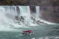 Aerial view of beautiful cruise ships with mesmerizing Niagara Falls waterfall in the background