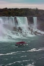 Aerial view of beautiful cruise ships with mesmerizing Niagara Falls waterfall in the background