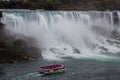 Aerial view of beautiful cruise ships with mesmerizing Niagara Falls waterfall in the background Royalty Free Stock Photo