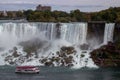 Aerial view of beautiful cruise ships with mesmerizing Niagara Falls waterfall in the background