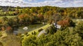 Aerial View of a Beautiful Estate, With a Pond, Gazebo and Many Buildings on an Autumn Day