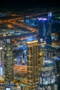 Aerial view of beautiful evening night illuminations scenic view of skyscraper and towers in Dubai. Street night traffic Royalty Free Stock Photo