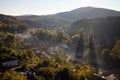 Aerial view of beautiful foggy village between mountains in Lovech, Bulgaria. Misty sunrise view of city district surrounded by