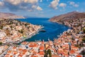 Aerial view of the beautiful greek island of Symi (Simi) with colourful houses and small boats. . Royalty Free Stock Photo