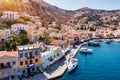 Aerial view of the beautiful greek island of Symi (Simi) with colourful houses and small boats.. Royalty Free Stock Photo