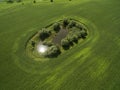 Aerial view of beautiful green agricultural fields wit a smal lake