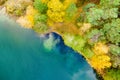 Aerial view of beautiful green waters of lake Gela. Birds eye view of scenic emerald lake surrounded by pine forests. Clouds Royalty Free Stock Photo