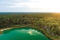 Aerial view of beautiful green waters of lake Gela. Birds eye view of scenic emerald lake surrounded by pine forests. Clouds Royalty Free Stock Photo