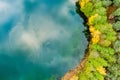Aerial view of beautiful green waters of lake Gela. Birds eye view of scenic emerald lake surrounded by pine forests. Clouds Royalty Free Stock Photo