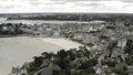 Aerial view of beautiful historical and modern buildings near the riverside in one of European city against grey cloudy Royalty Free Stock Photo