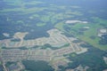 Aerial view of beautiful house, pond, forest and community in Florida