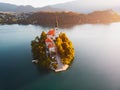 Aerial view of beautiful Lake Bled in the middle of the charming little island and the wonderful church at summer sunrise