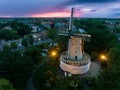 Aerial view of a beautiful landscape with a majestic windmill at sunset Royalty Free Stock Photo