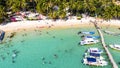 Aerial view of beautiful landscape, tourism boats, and people swimming on the sea and beach on May Rut island (a tranquil island