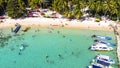 Aerial view of beautiful landscape, tourism boats, and people swimming on the sea and beach on May Rut island (a tranquil island