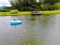 Aerial view of beautiful little wood cabana next the lake in tropical mountain,