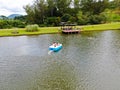 Aerial view of beautiful little wood cabana next the lake in tropical mountain,