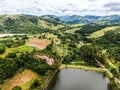 Aerial view of beautiful little wood cabana next the lake in tropical mountain,