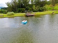 Aerial view of beautiful little wood cabana next the lake in tropical mountain,
